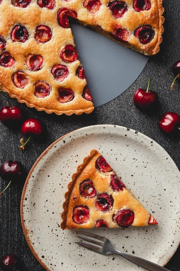 slice of cherry frangipane tart