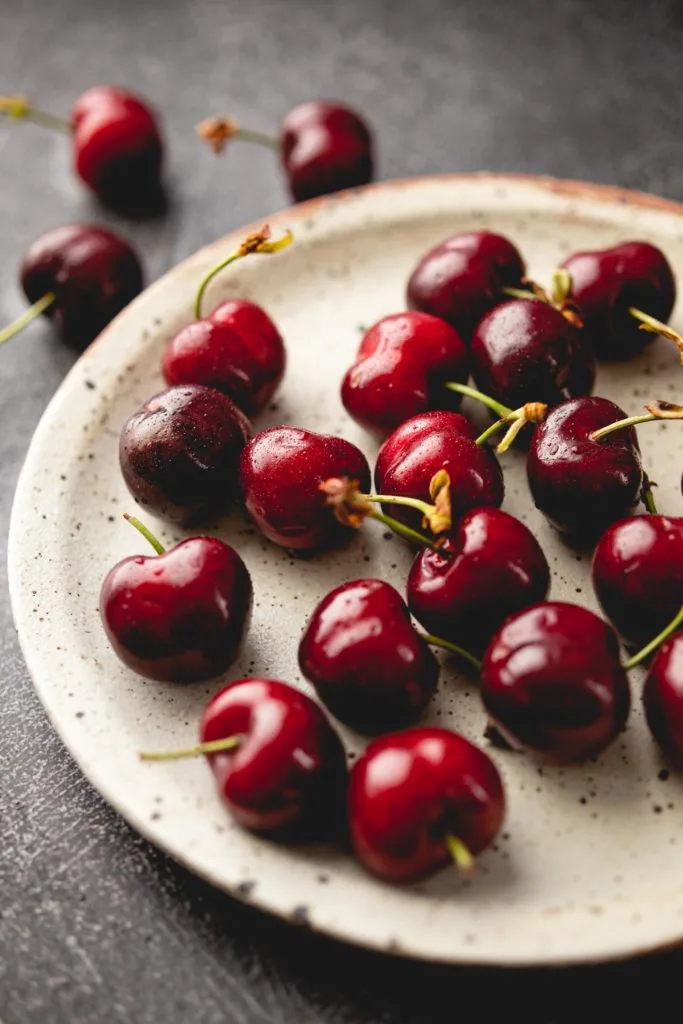 plate of fresh cherries